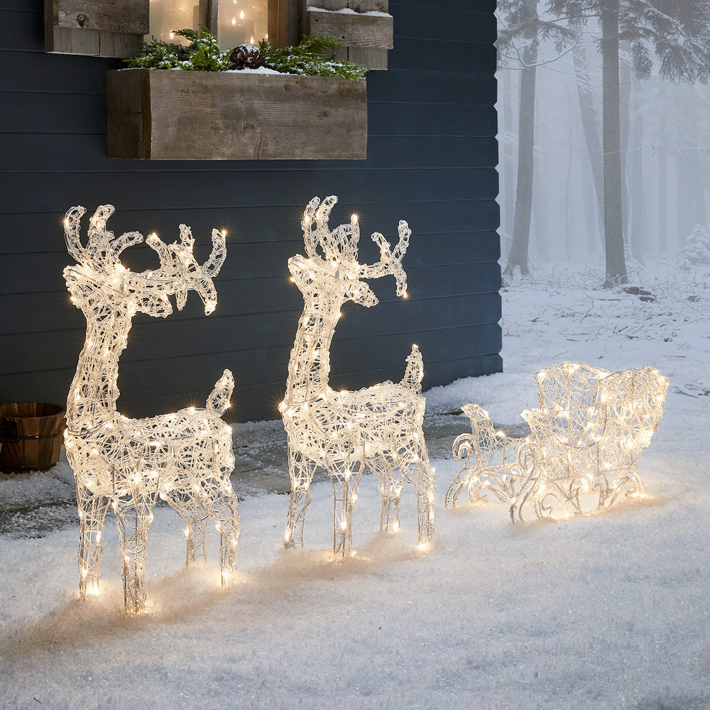 Bicolor Solar-LED-Rentiere mit Schlitten Swinsty